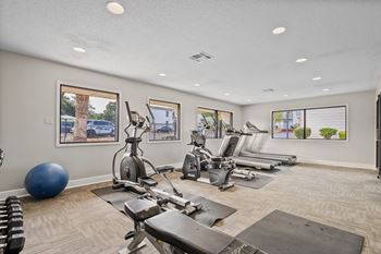 Fitness center with cardio and strength training equipment at 701 south apartments in mobile, al